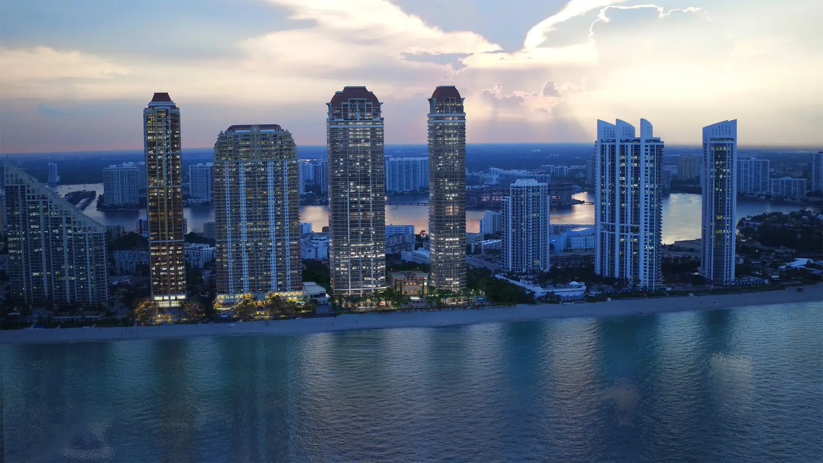 The Acqualina towers from the ocean at dusk
