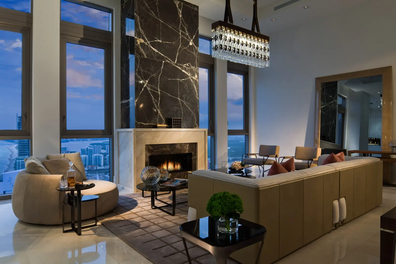 Residence living room with fireplace and ocean view (tower not specified by source)
